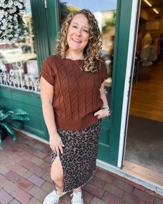 A leopard print denim midi skirt with front side slit