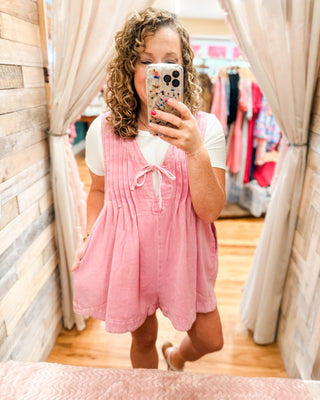 Denim Darling Sleeveless V-Neck Pleated Romper in pink with basic bodysuit underneath