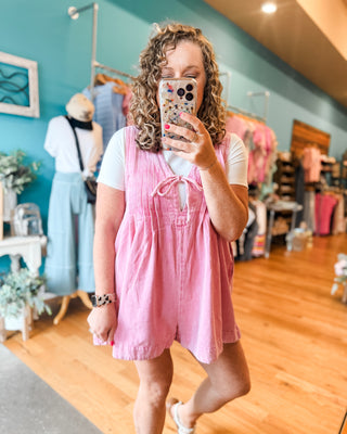 Denim Darling Sleeveless V-Neck Pleated Romper in pink with basic bodysuit underneath