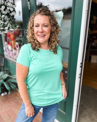 a green rounded hem basic top