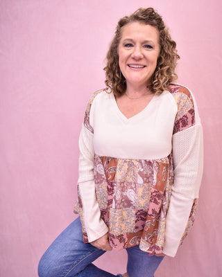 a long sleeve waffle knit and paisley patch baby doll top
