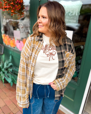 Perfectly Undone Mixed Print Plaid Distressed Top A long sleeve button down mixed print plaid top.