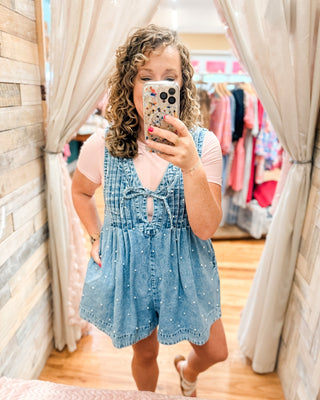 A Pearly Darling Denim V-Neck Pleated Romper - The Southern Loft