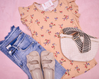 A floral flutter sleeve rib knit top in peach