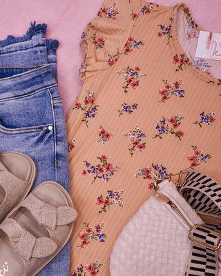 A floral flutter sleeve rib knit top in peach