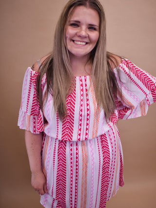 a mini dress with multi colors aztec design