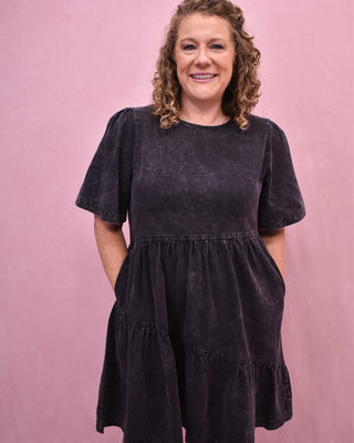 a short sleeve asymmetrical black denim dress