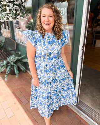 A watercolor tiered midi dress with floral print, double ruffle cap sleeve