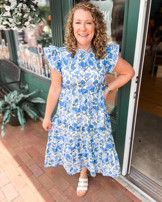 A watercolor tiered midi dress with floral print, double ruffle cap sleeve