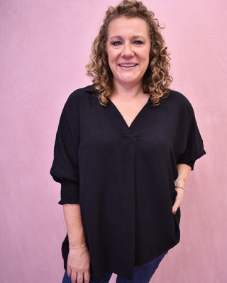 a 3/4 sleeve vneck oversized top