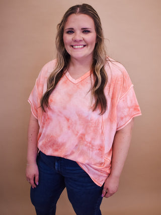 A Tie-Dye Short Sleeve Top – a lightweight, colorful tee perfect for casual everyday wear.