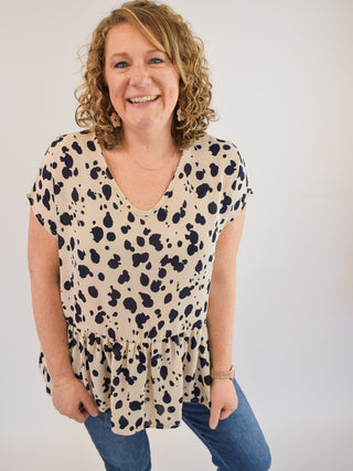 A lightweight sheer style animal print blouse