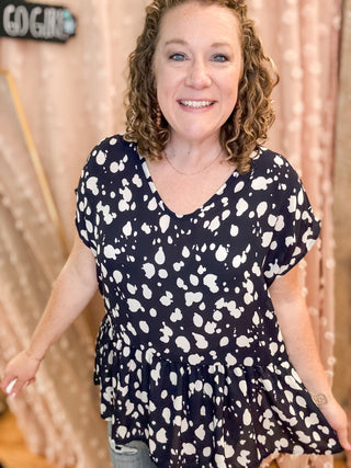 A lightweight sheer style animal print blouse