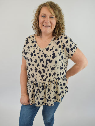 A lightweight sheer style animal print blouse