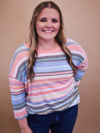 a multi color textured 3/4 sleeve top