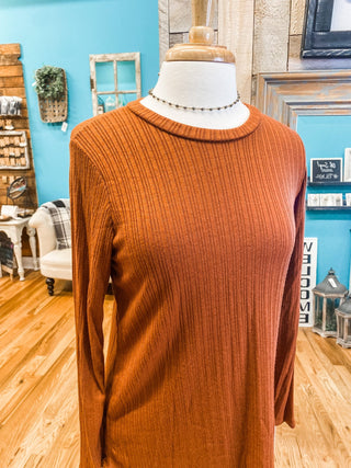 A long sleeve textured style top in a rust orange.