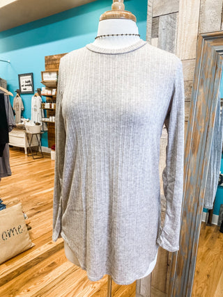 A long sleeve textured style top in an oatmeal gray.