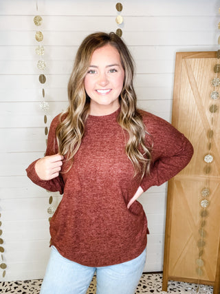 Brushed melange style oversized sweater in a rust color