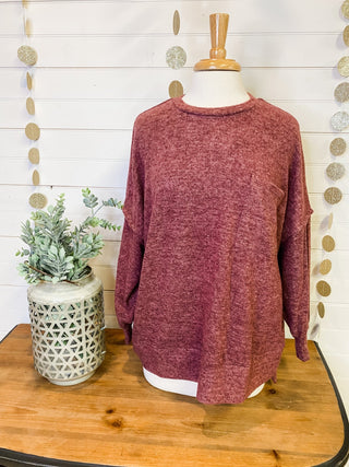 Brushed melange style oversized sweater in a rust color