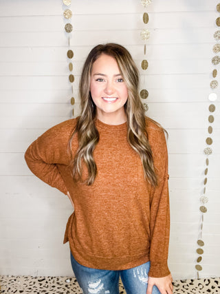 Brushed melange style oversized sweater in a rust color