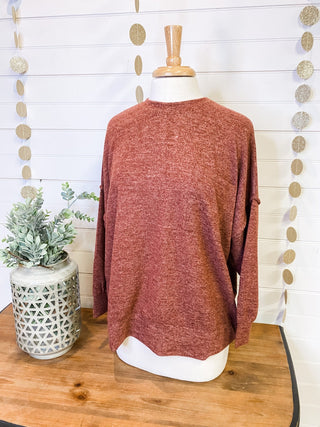 Brushed melange style oversized sweater in a rust color