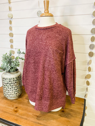 Brushed melange style oversized sweater in a rust color