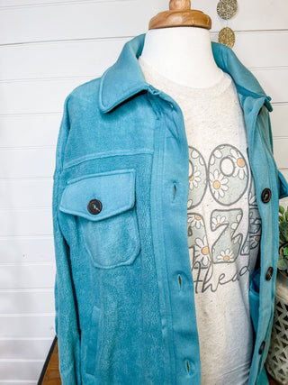 A teal fleece button down shacket