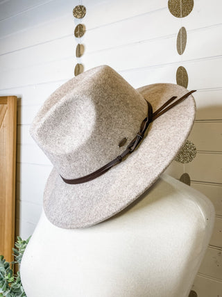 a felt wide brim hat with leather belt strap