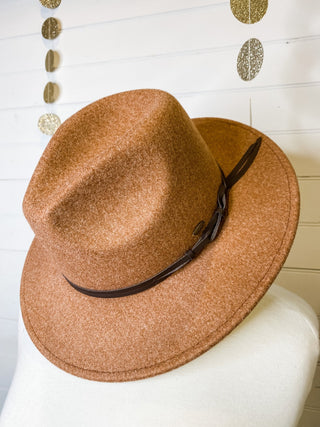 a felt wide brim hat with leather belt strap