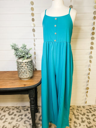 A wide leg sleeveless style jumpsuit in a teal color