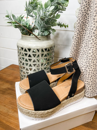 black espadrille style sandals with ankle strap