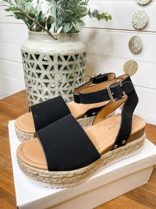 black espadrille style sandals with ankle strap